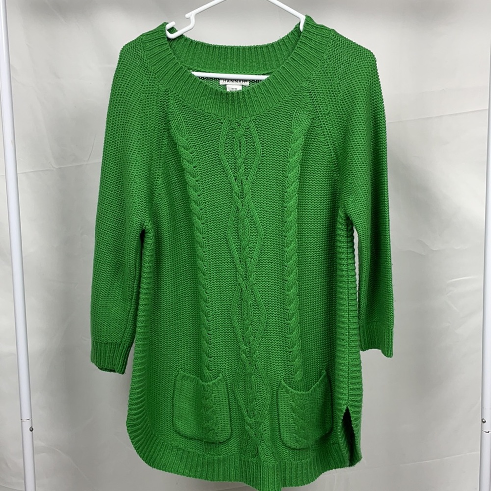 Green sweater, size medium.